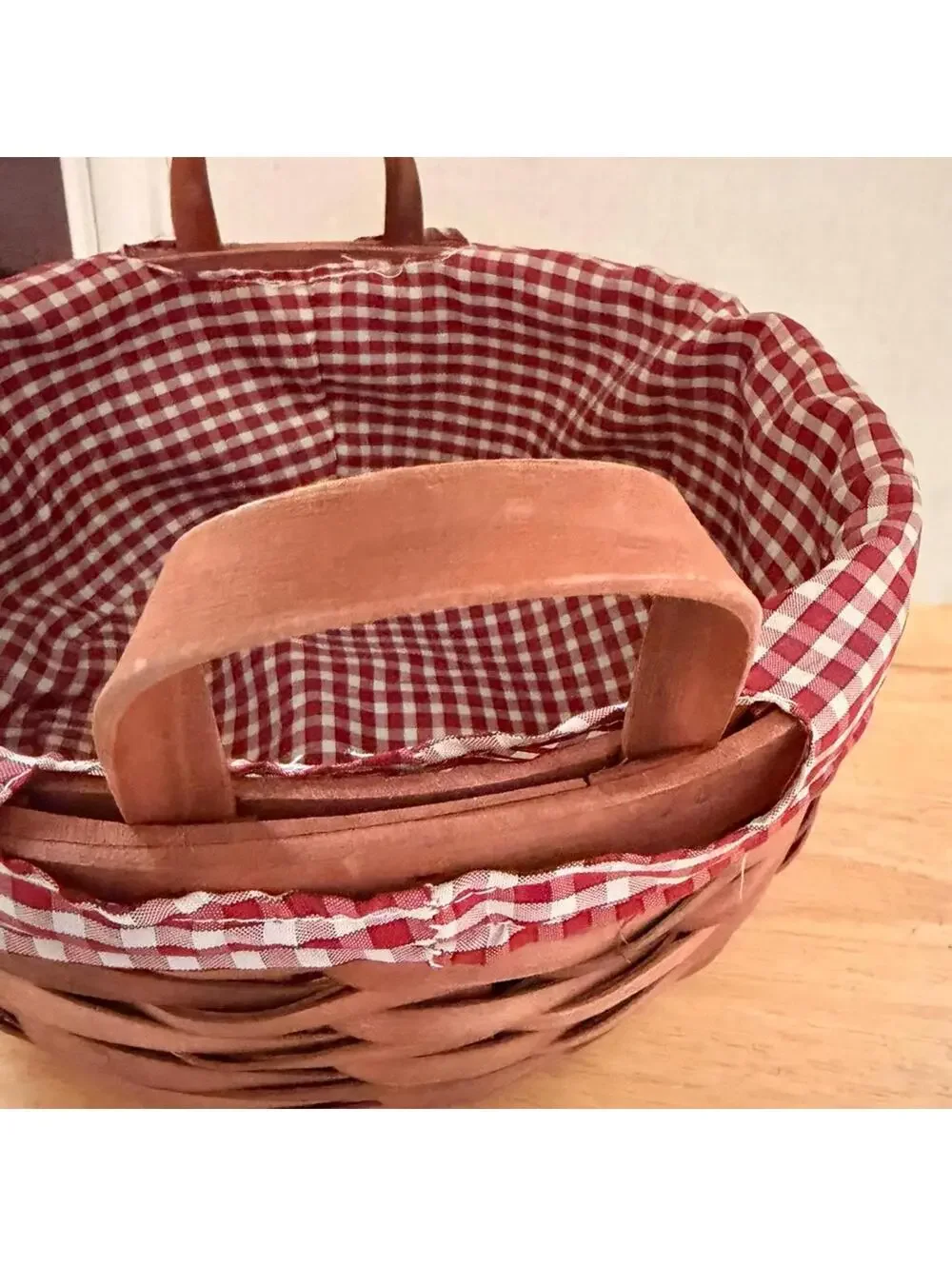 Vintage Country charm Christmas holiday basket with a red gingham fabric liner.